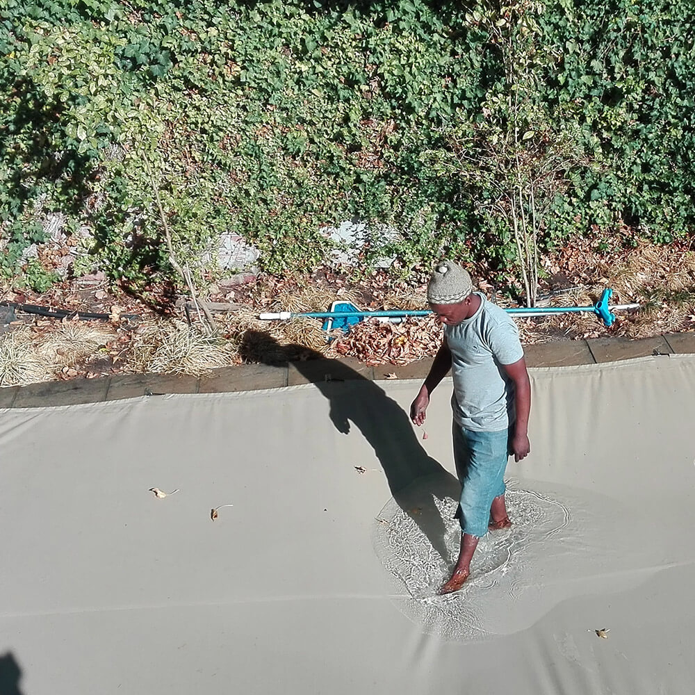 Touareg pool cover with mans walking on it